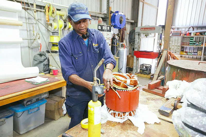 Dewatering pump motor being repaired